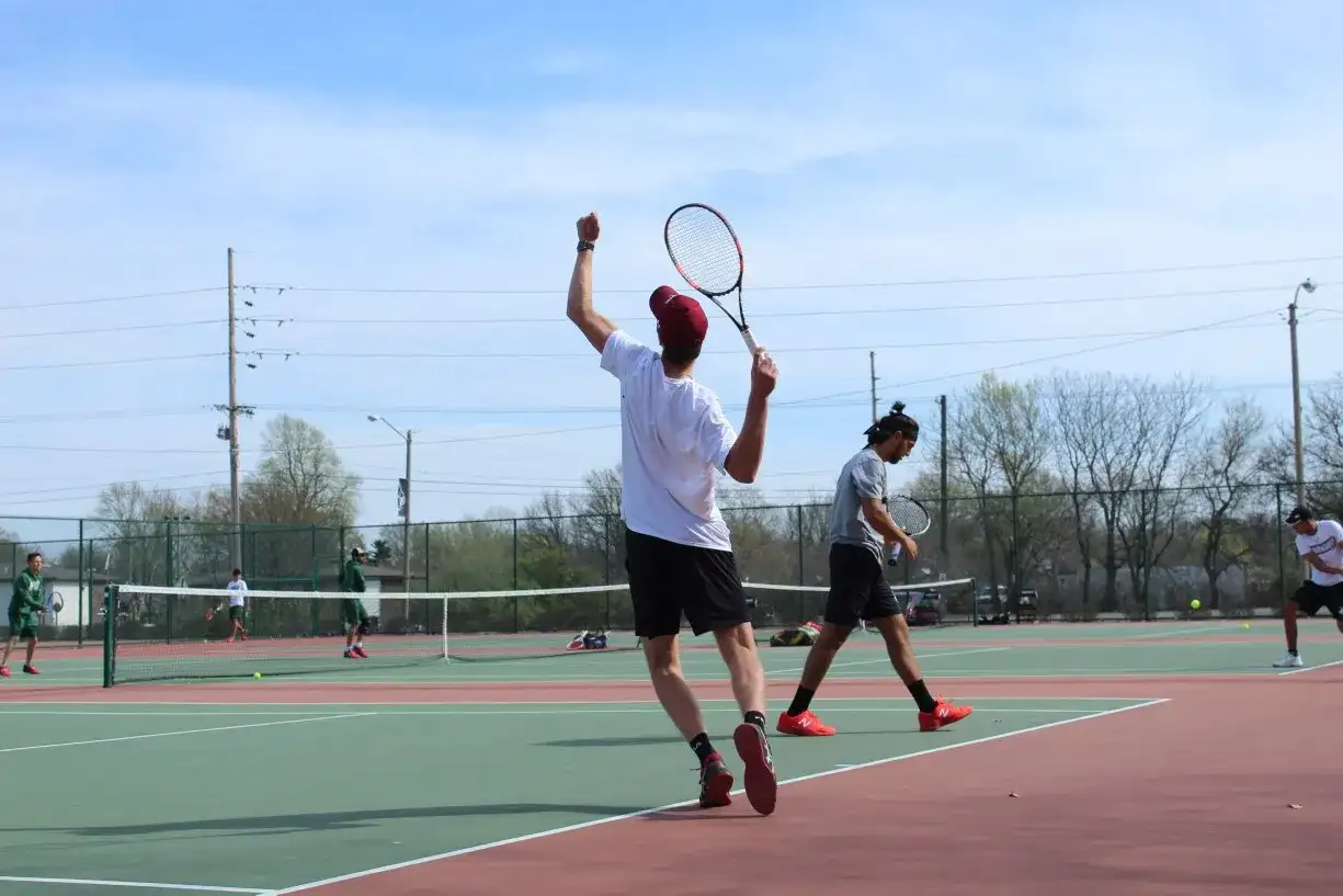 A private tennis lesson on an outdoor tennis court in Chicago